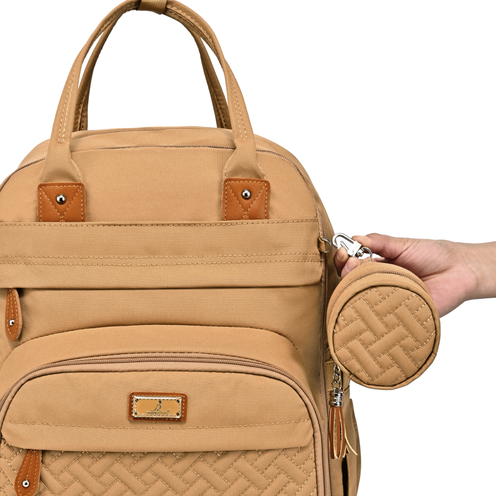 beige original diaper bag pacifier pocket