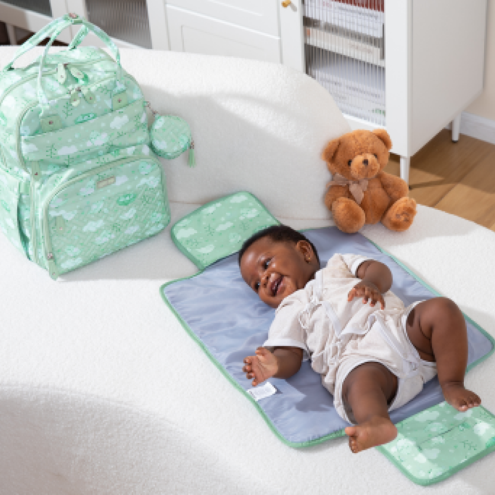 green birdy diaper bag and changing pad lifestyle